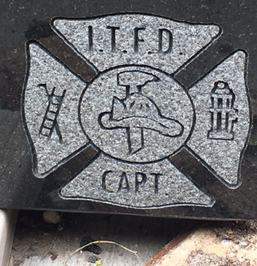 firefighter emblem on headstone