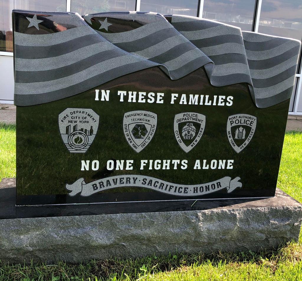 Headstone engraving and epitaph honoring police and firefighters