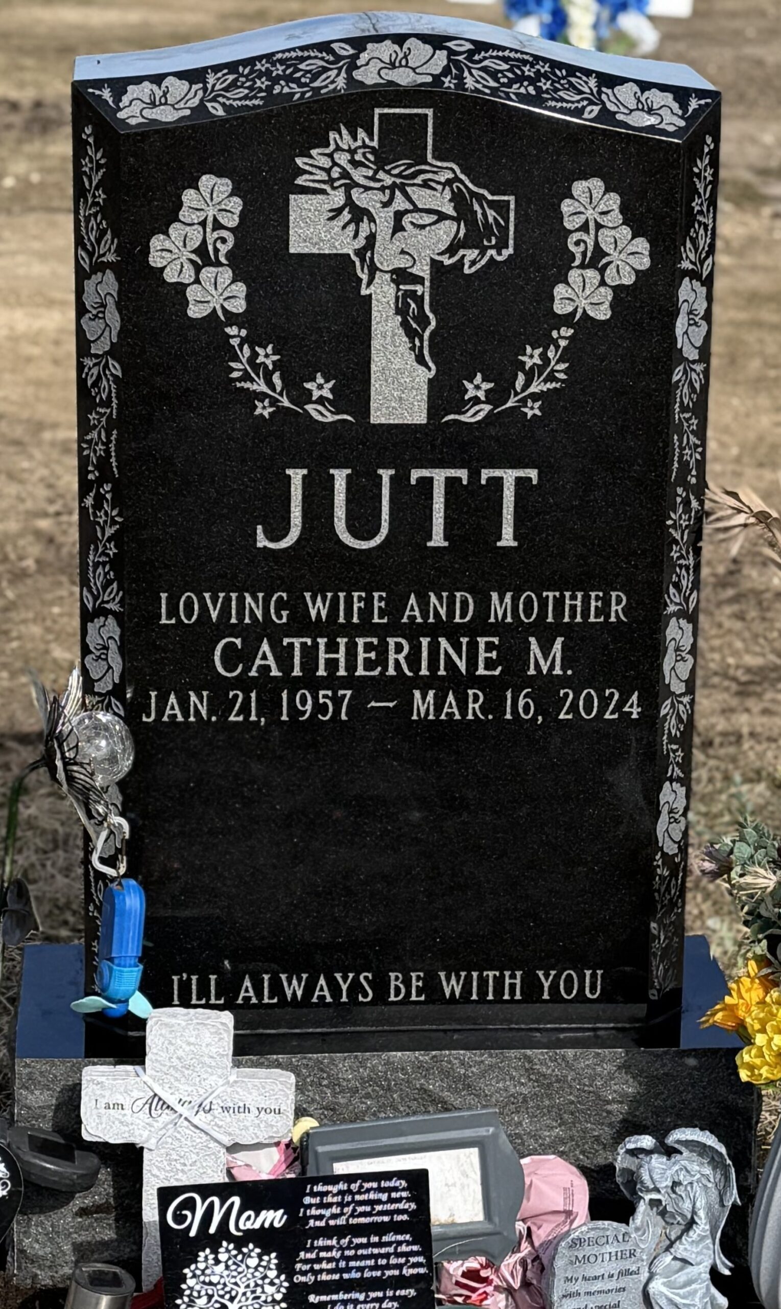 Upright monument with colorful inscriptions on black granite by St Charles Monuments